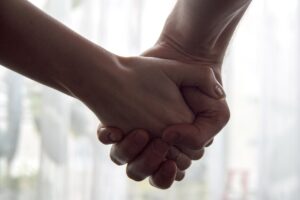 Holding hands. Women’s Mental Health & Wellbeing